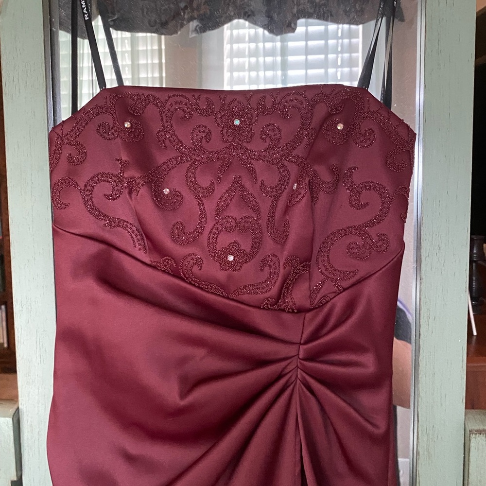 Red A-line beaded prom dress.